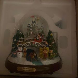 Snow globe with sound and buttons on back to blow the snow around the snow globe